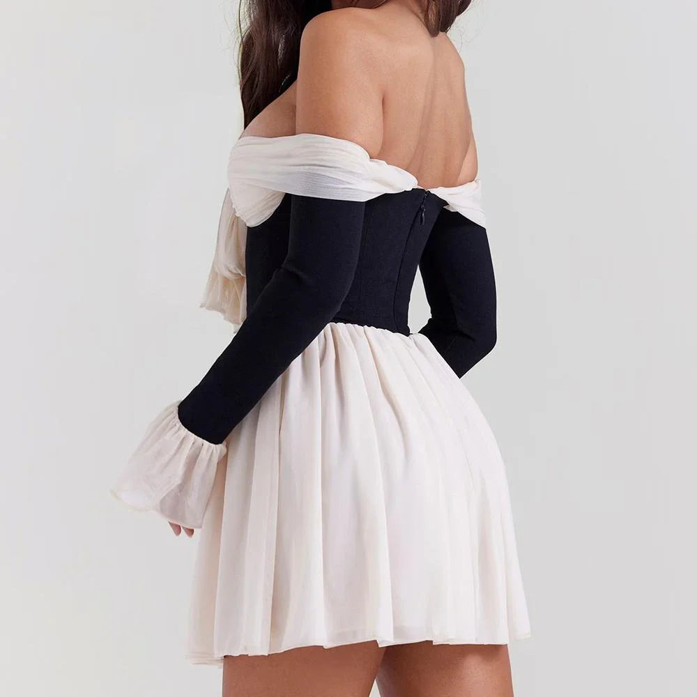 Captivating strapless backless mini dress with flared sleeves in a patchwork pattern, perfect for parties and events