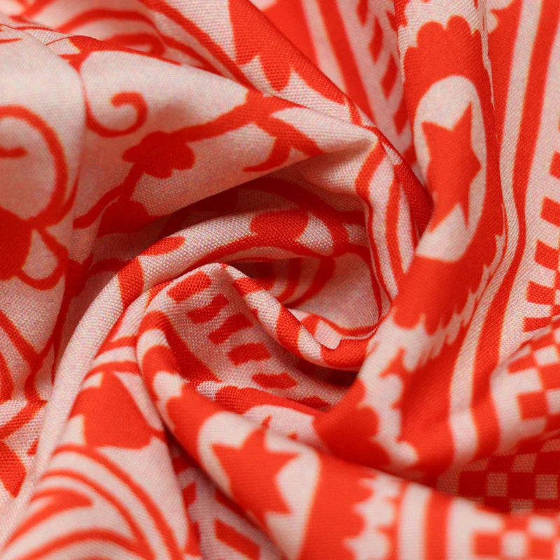 Floral print sling dress with mid-length design, available in sizes S-XL and orange red color