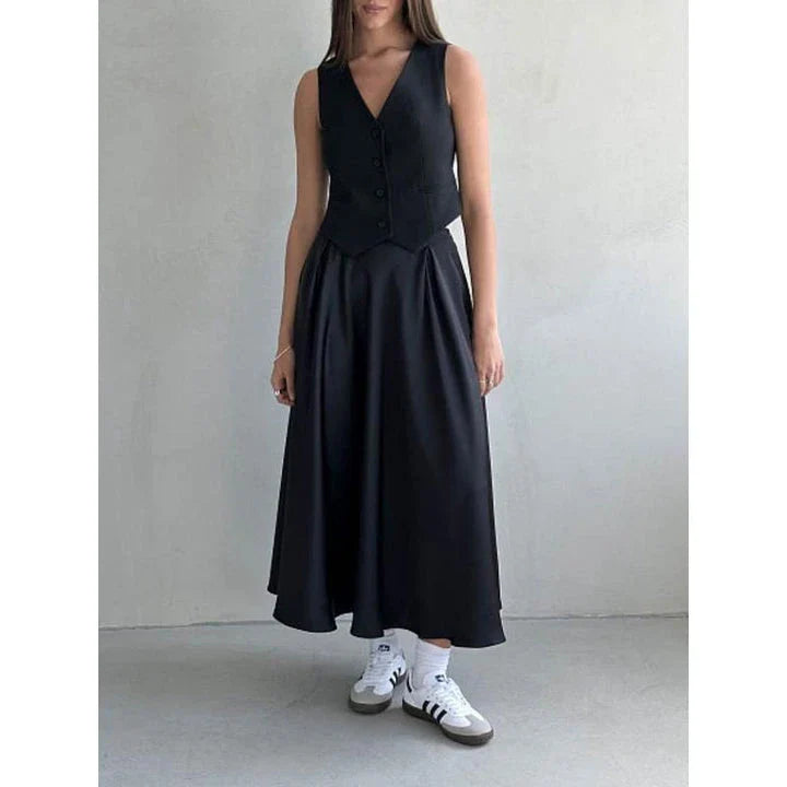Elegant high-waisted satin maxi skirt in black for women, showcasing a flowing, sophisticated silhouette.
