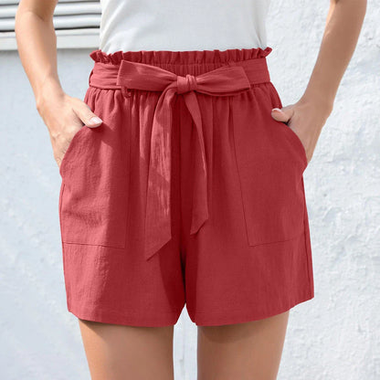 Ruffle bow waist tie shorts in black, made of lightweight and breathable polyester fabric, with convenient pockets for storage