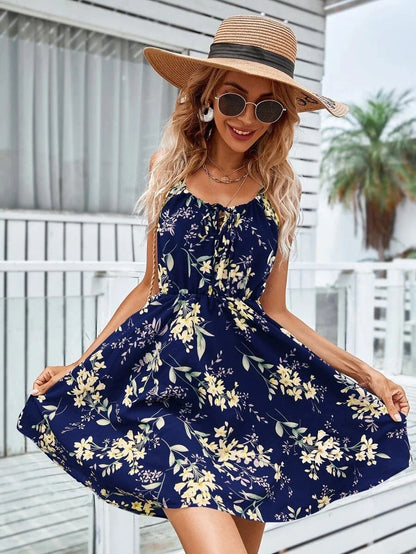 A stylish floral print suspender dress with an elastic waist, perfect for summer fashion and casual or dressy occasions.