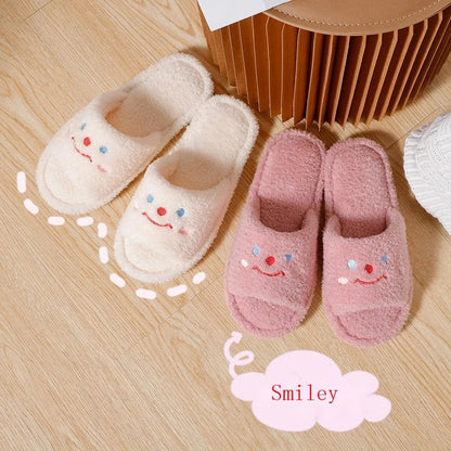 Cozy plush slippers with a smiling face design for comfortable indoor wear