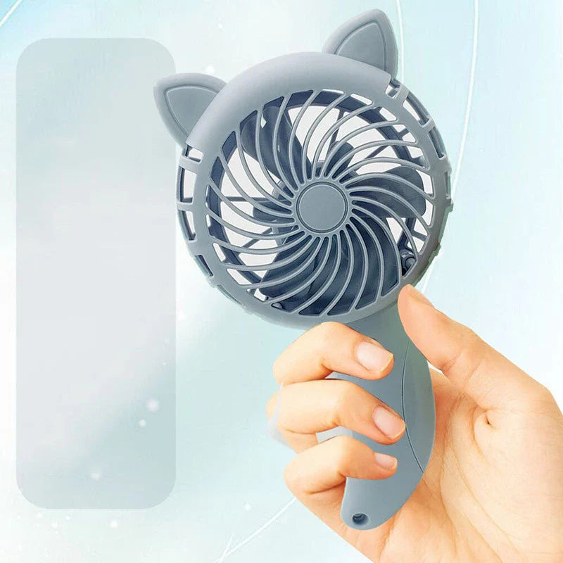 Convenient hand-held fan with a large cartoon hand design for activating the gentle breeze
