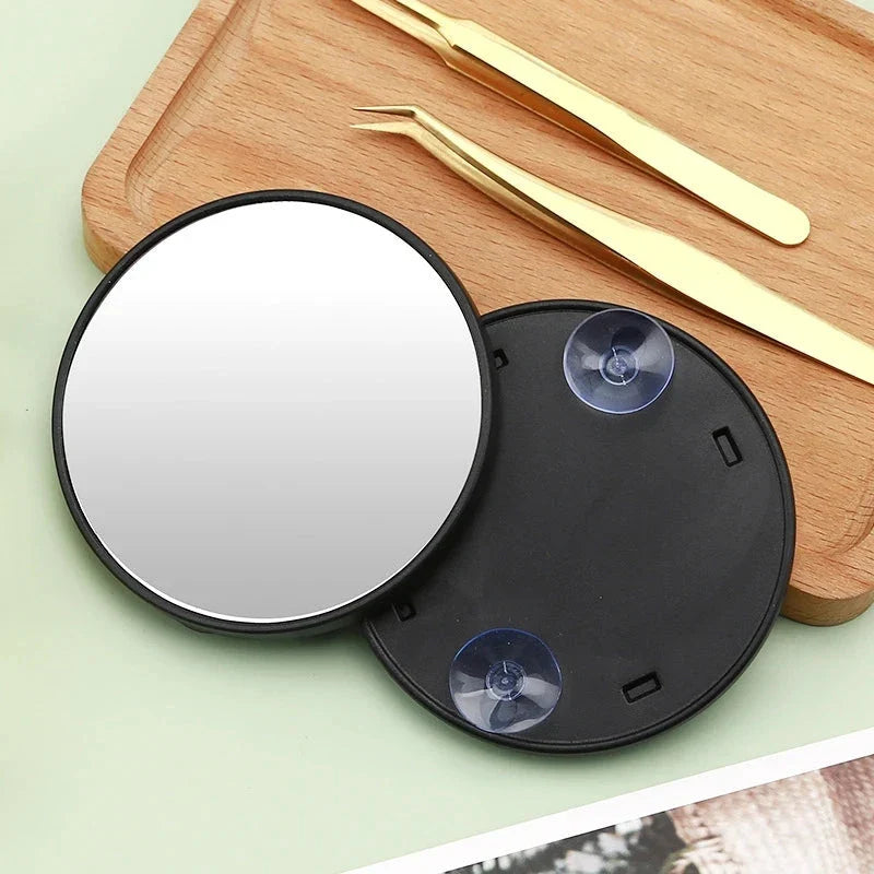 A high-definition magnifying mirror with a strong suction cup attachment for hands-free use in the bathroom or on the go.
