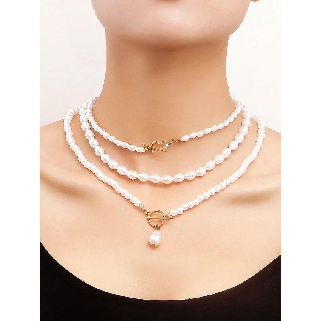 Elegant imitation pearl heart pendant necklace with lustrous bead chain and secure OT buckle closure