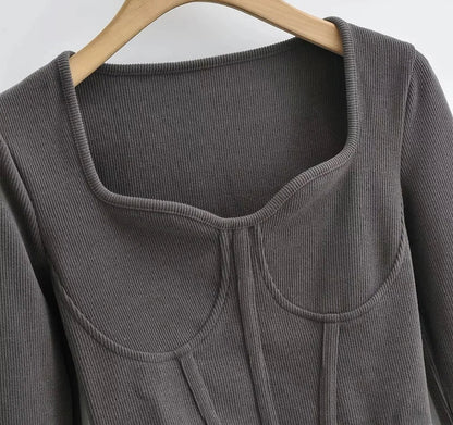 A stylish slim-fit short autumn top with an open waist design, made of premium polyester fabric with long sleeves and a square collar.