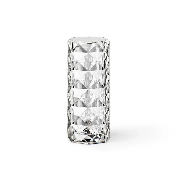 Elegant diamond-inspired crystal lamp with touch-sensitive dimming controls, providing adjustable ambient lighting for bedrooms and living spaces.