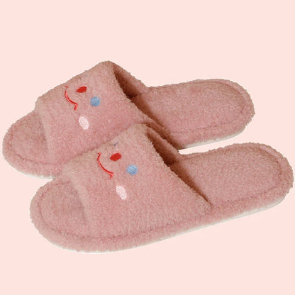 Cozy plush slippers with a smiling face design for comfortable indoor wear
