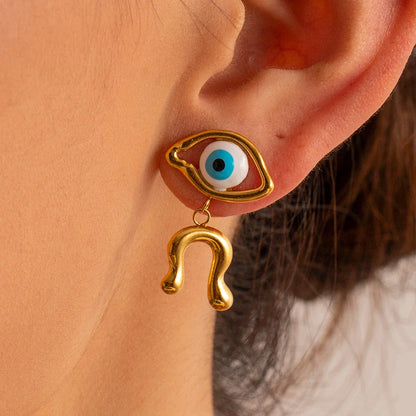 Pair of 18K gold plated stainless steel asymmetrical devil's eye earrings with a dripping oil finish