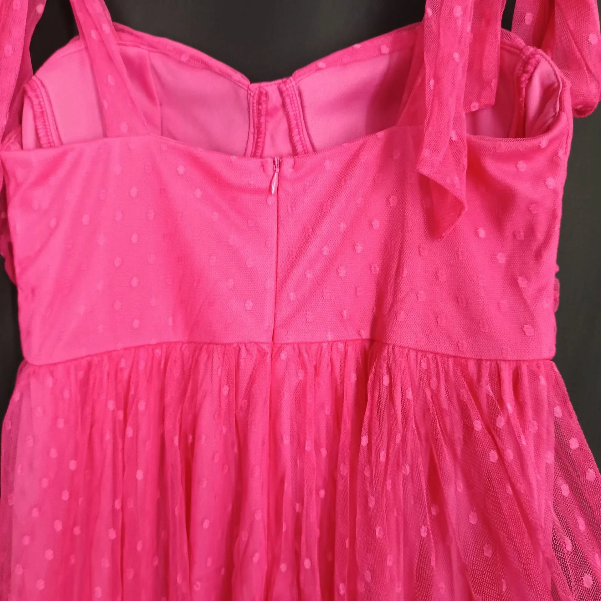 Fairy-inspired dress with mid-length silhouette, lace-up details, and luxurious polyester fabric