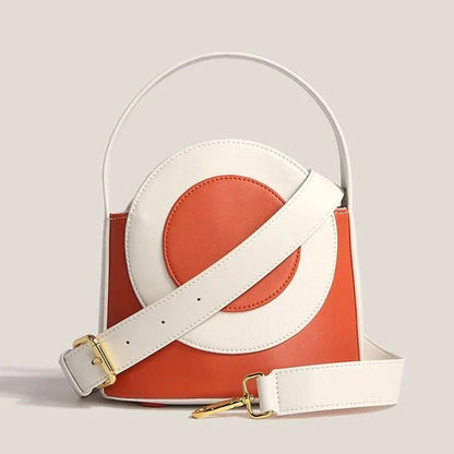 Chic color block vegan leather bucket bag with adjustable strap, perfect for everyday use and special occasions