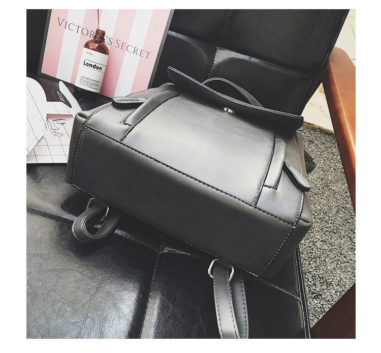 Versatile British-inspired shoulder bag made from high-quality PU leather with a spacious main compartment, convenient pockets, and an adjustable strap