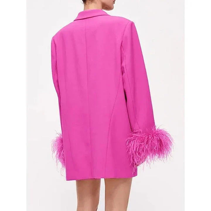 Stylish pink feather-embellished blazer with notched collar, perfect for adding sophistication to any outfit