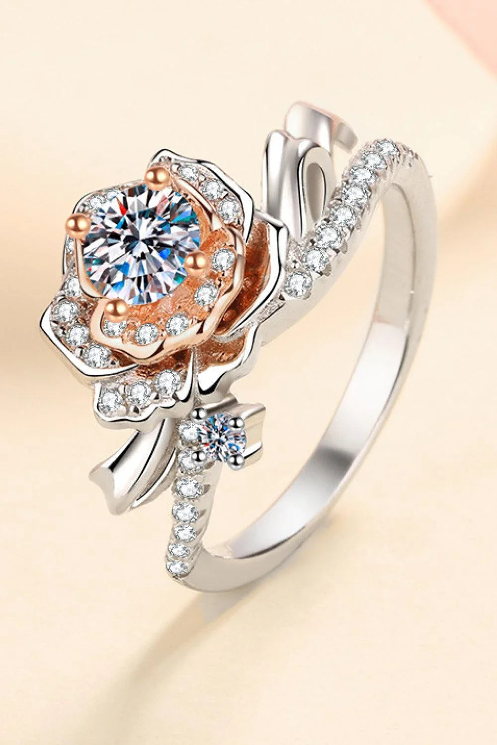 Elegant rose-shaped moissanite ring in sterling silver with a sparkling center stone and zircon accents