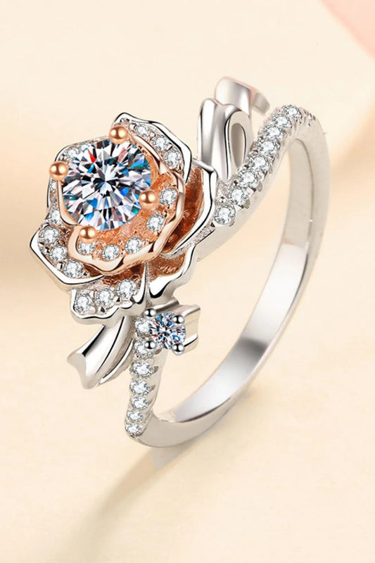 Elegant rose-shaped moissanite ring in sterling silver with a sparkling center stone and zircon accents