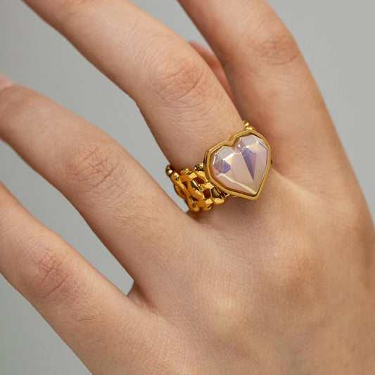 Adjustable stainless steel ring with mermaid heart design and shell bead accents, perfect for adding a touch of bohemian style to any outfit.