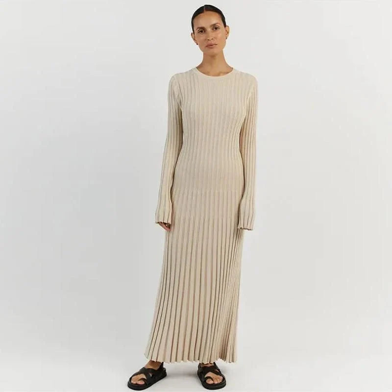 Timeless elegant pleated knit dress in black, perfect for summer office wear with a sophisticated and comfortable design.