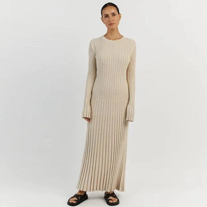 Timeless elegant pleated knit dress in black, perfect for summer office wear with a sophisticated and comfortable design.