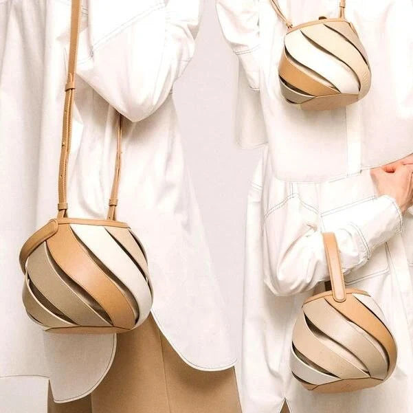 Colorful striped PU leather bucket handbag with adjustable strap and roomy interior