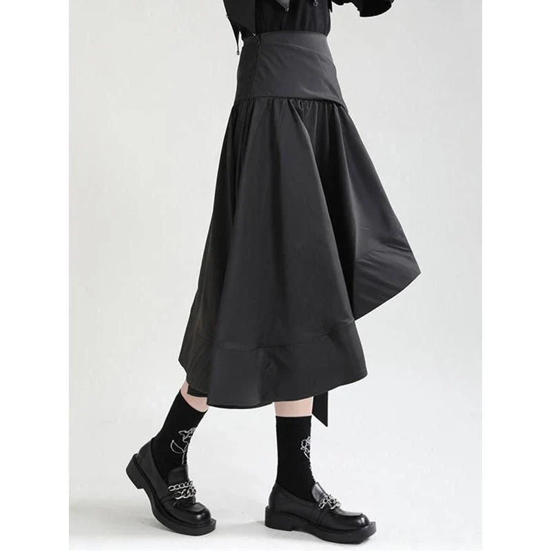 A black high-waist asymmetrical ruffle skirt with a unique design and flattering silhouette.