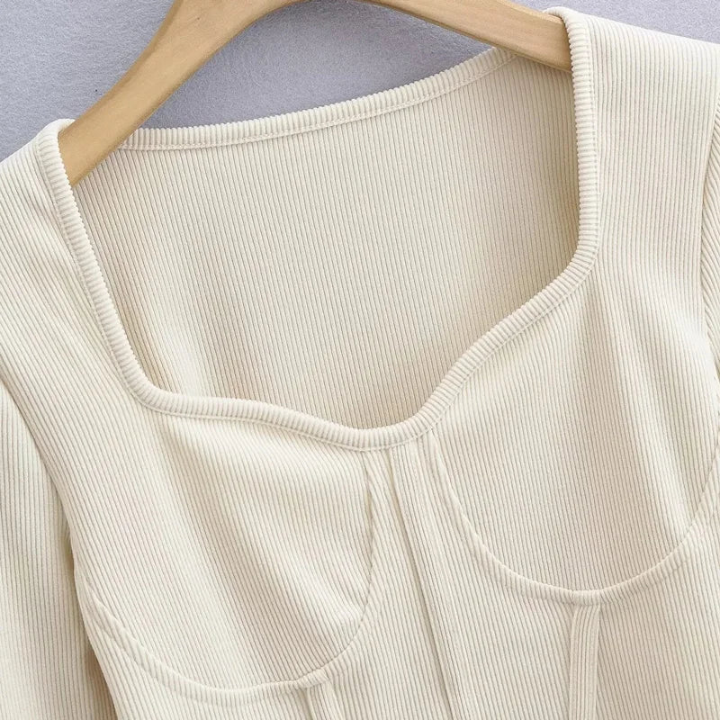 A stylish slim-fit short autumn top with an open waist design, made of premium polyester fabric with long sleeves and a square collar.
