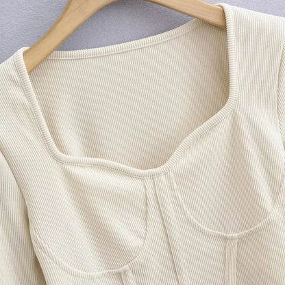 A stylish slim-fit short autumn top with an open waist design, made of premium polyester fabric with long sleeves and a square collar.