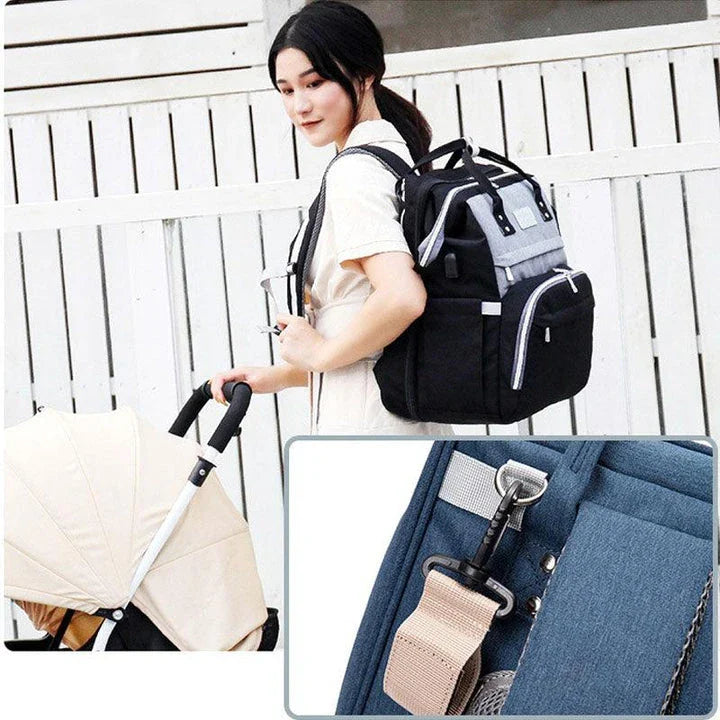 Multifunctional maternity diaper backpack with detachable crib, large capacity, and water-resistant design for travel