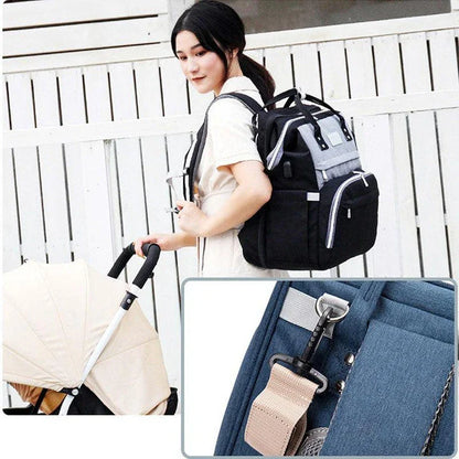 Multifunctional maternity diaper backpack with detachable crib, large capacity, and water-resistant design for travel