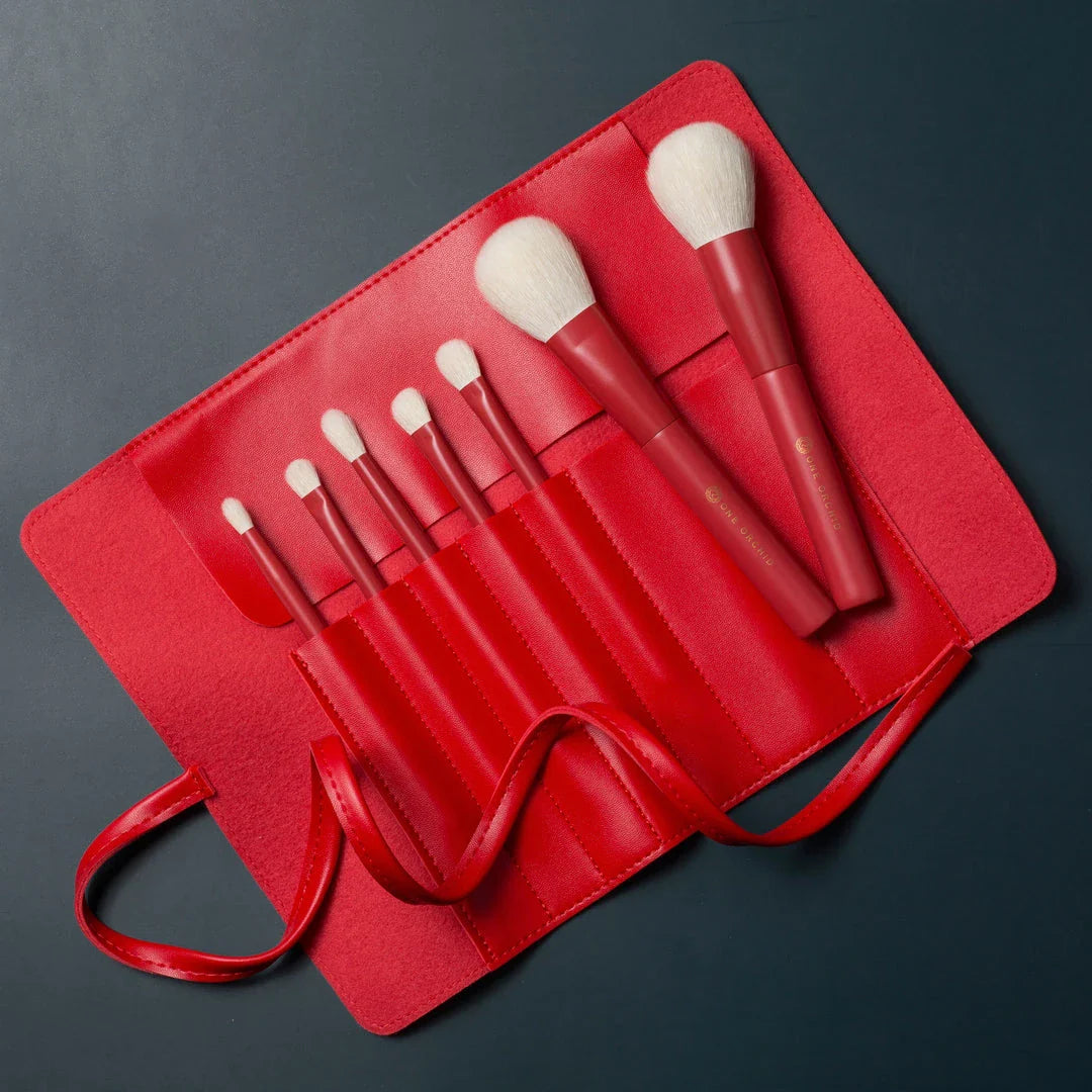 7-piece premium red makeup brush set with goat hair bristles, wooden handles, and aluminum ferrules for flawless powder, eye shadow, and blush application