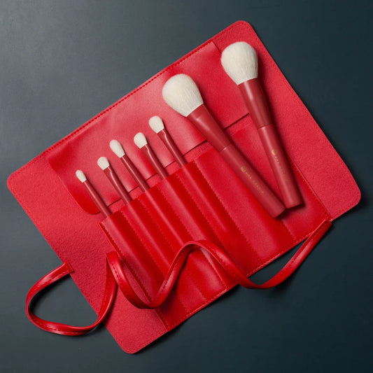 7-piece premium red makeup brush set with goat hair bristles, wooden handles, and aluminum ferrules for flawless powder, eye shadow, and blush application