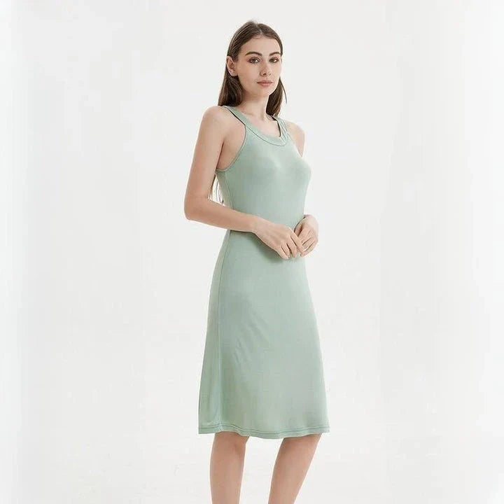 Elegant silk-blend halter neck midi dress in green and white colors, showcasing a chic and versatile design for modern American women.