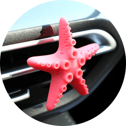 Cute mini starfish car vent air freshener in a rosy-pink color, emitting a refreshing cherry scent