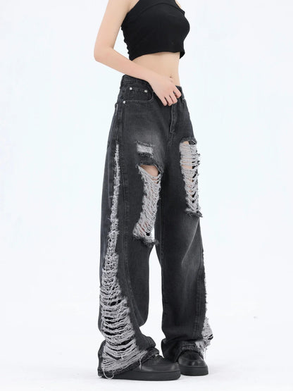 Premium loose fit distressed denim trousers for men and women, featuring a relaxed silhouette, high-quality cotton construction, and trendy distressed details.