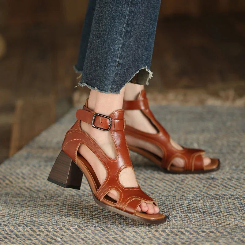 Elegant leather gladiator sandals with adjustable buckle closure and square high heel for stylish summer occasions
