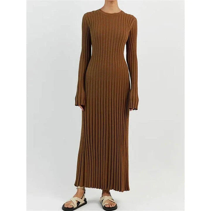 Timeless elegant pleated knit dress in black, perfect for summer office wear with a sophisticated and comfortable design.