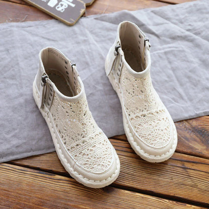 Flat-soled women's Martin boots in grey and beige colors, featuring a denim upper and rubber sole for comfortable, everyday wear.