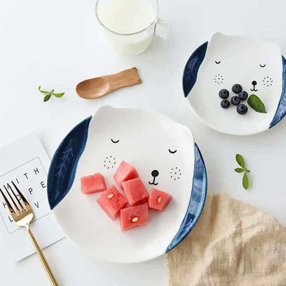 Charming ceramic plate with whimsical animal patterns, available in small and large sizes, perfect for serving meals and snacks.