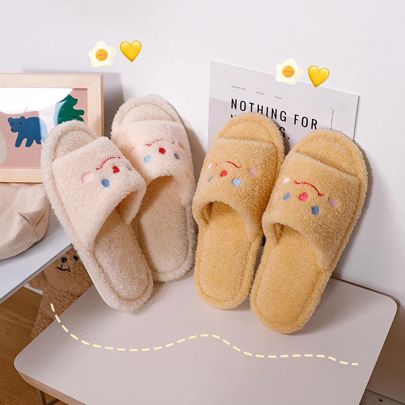 Cozy plush slippers with a smiling face design for comfortable indoor wear