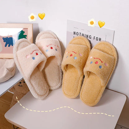 Cozy plush slippers with a smiling face design for comfortable indoor wear
