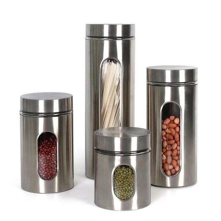 Stainless steel and glass spice jars in various sizes with airtight lids, perfect for organizing and preserving spices in a modern kitchen.
