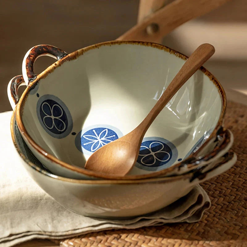 Elegant porcelain noodle and soup bowl with a comfortable handle, perfect for serving a variety of hot and cold dishes.