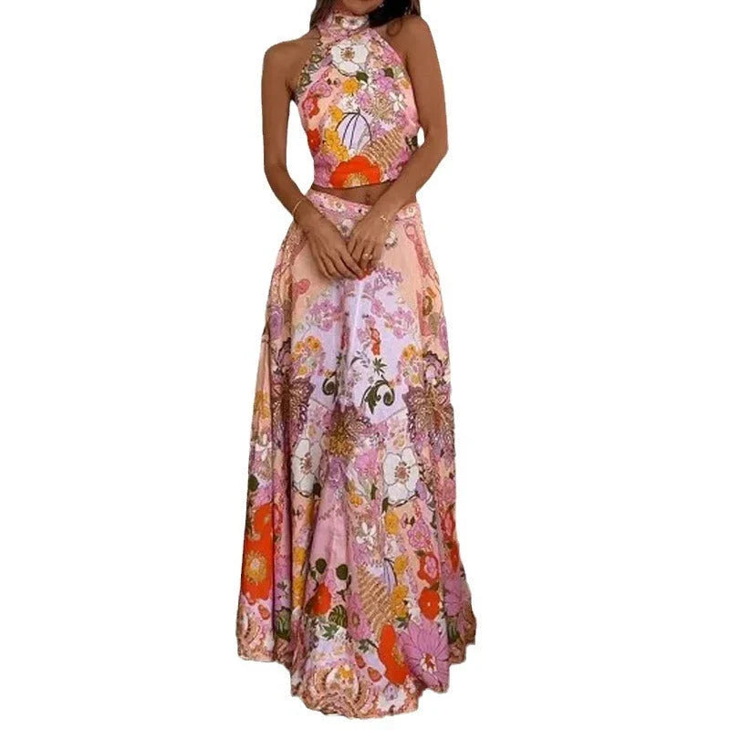 Stylish sleeveless midi skirt suit with vibrant floral print, featuring a half-turtleneck design and comfortable A-line silhouette.