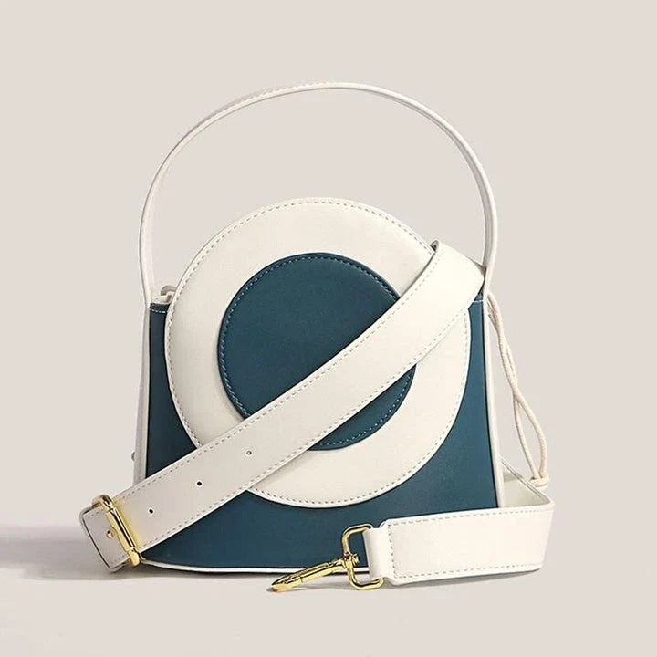 Chic color block vegan leather bucket bag with adjustable strap, perfect for everyday use and special occasions