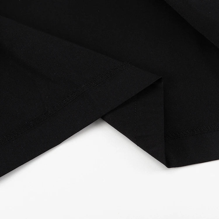 Black and white color-blocked dress with long sleeves and a doll collar, showcasing a timeless and sophisticated style.