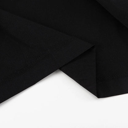 Black and white color-blocked dress with long sleeves and a doll collar, showcasing a timeless and sophisticated style.