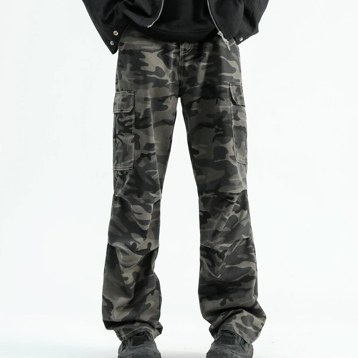 Stylish paratrooper denim trousers with a mid-waist silhouette and straight leg cut, featuring a camouflage pattern and premium cotton construction for rugged, versatile wear.