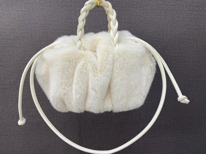 Elegant pleated leather and mink fur handbag in various colors, featuring a chic and modern cloud-like design