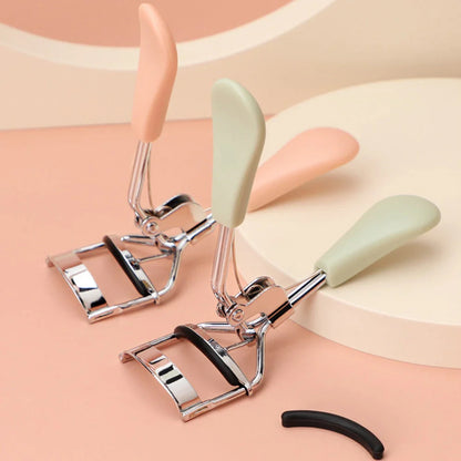 Heatless manual eyelash curler with curved design and silicone lash pad for effortless, dramatic lash curl