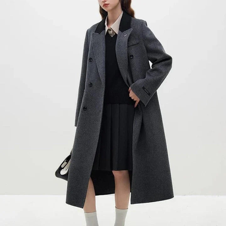 A luxurious 100% wool women's long grey coat with a timeless double-breasted design and stylish notched collar