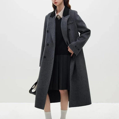 A luxurious 100% wool women's long grey coat with a timeless double-breasted design and stylish notched collar